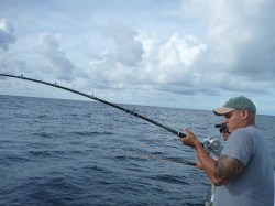 Crabman fighting a gag grouper